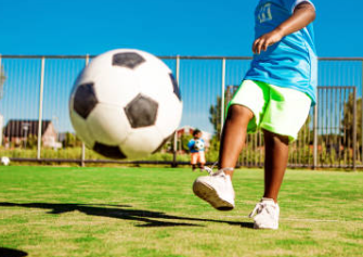 A kid playing ball