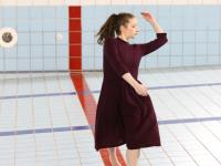 Student dancing in pool